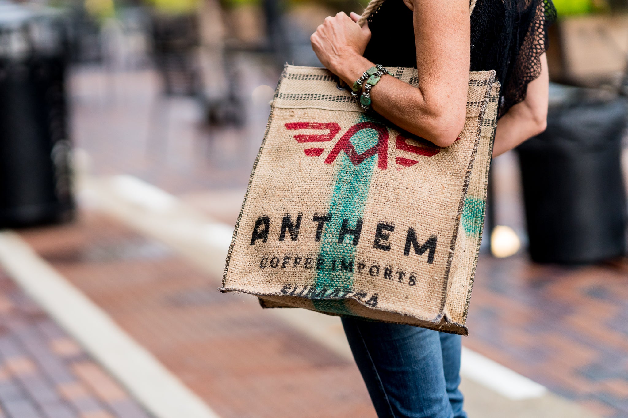 Custom coffee sack bag carried on a city street