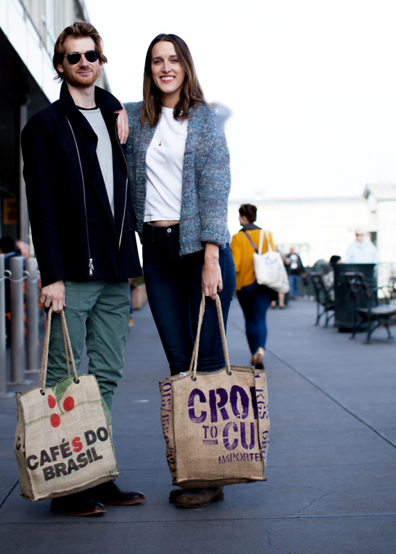 Two custom coffee sack tote bags carried outdoors