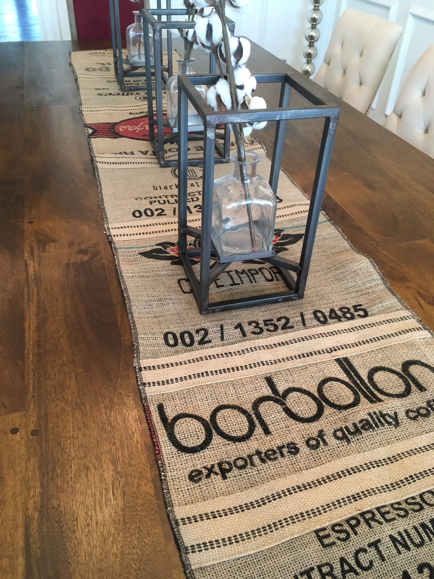 Coffee sack table runner with glass and metal table decor