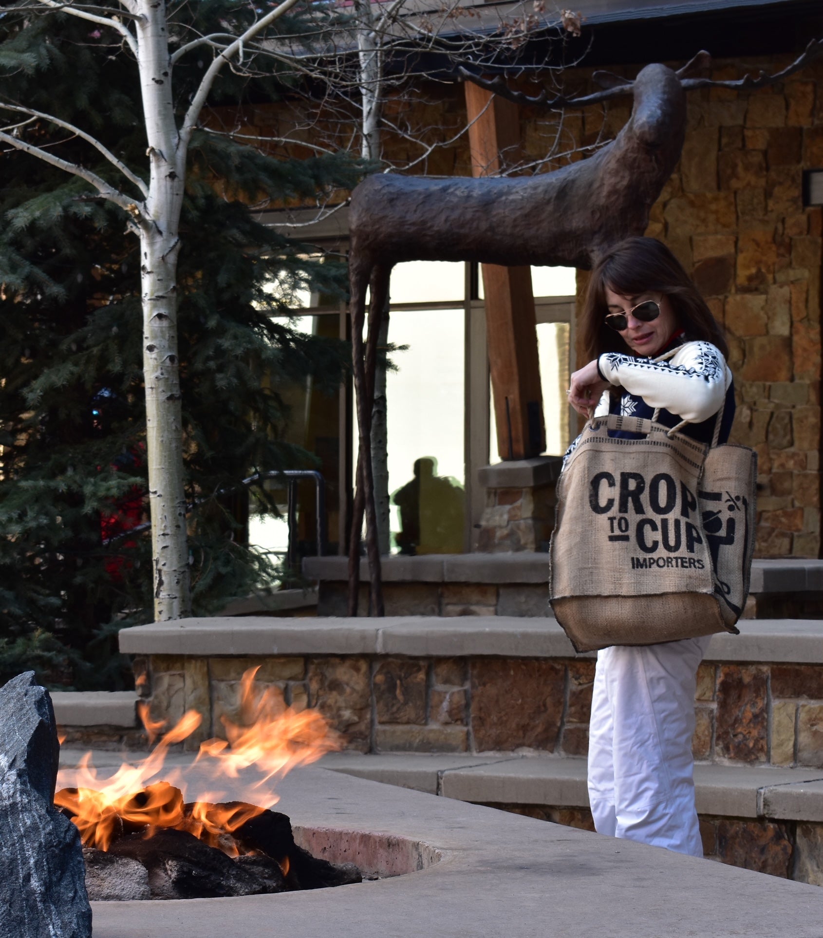 Custom coffee sack bag carried near a mountain fire pit