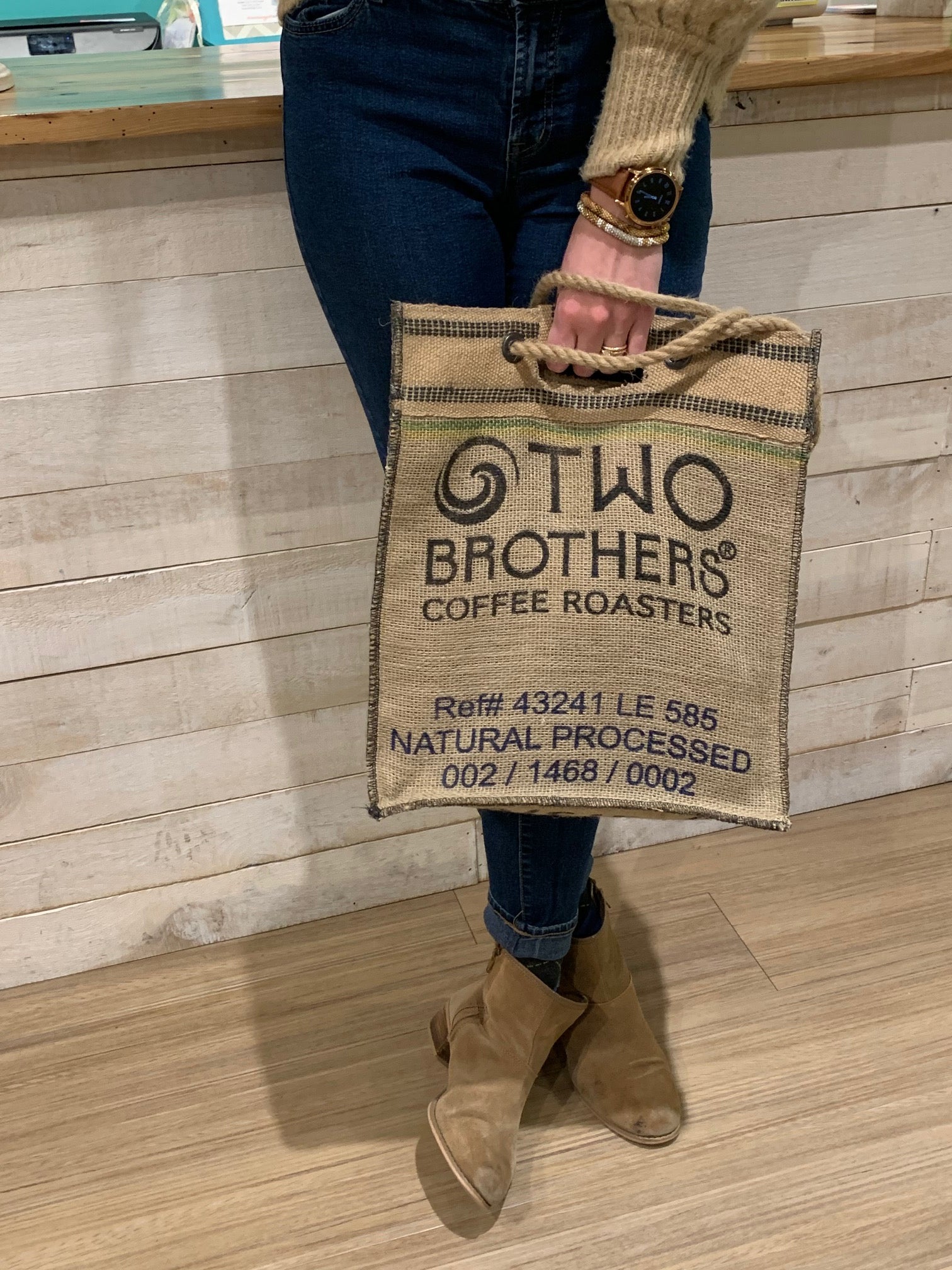 Custom Two Brothers coffee sack tote carried indoors