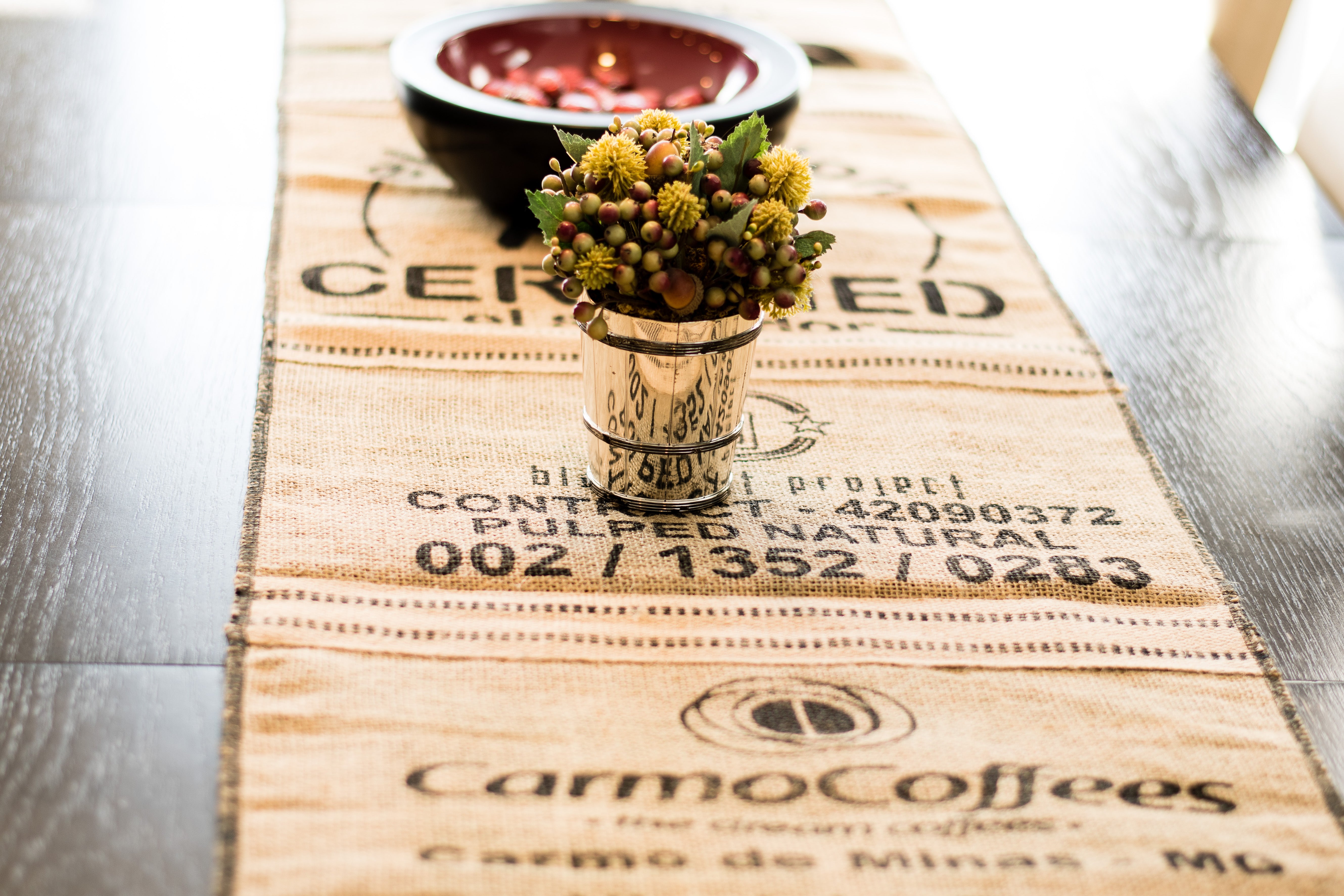 Coffee sack table runner with floral centerpiece